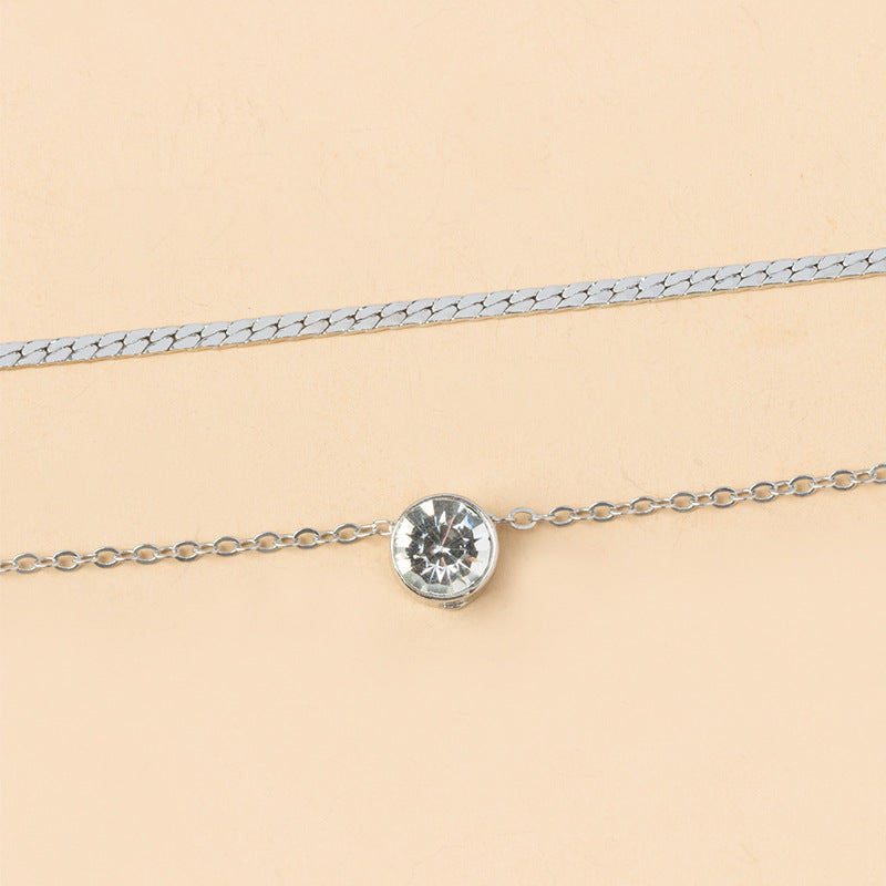 Elegant silver-plated double-layer necklace. Lightweight, delicate chains. Perfect for layering over sweaters & everyday elegance.
