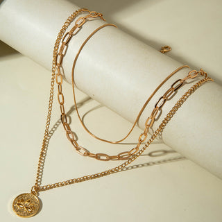 Elegant layered Y-necklace with pendant & multi-strand chains. Gold-plated stainless steel. Perfect for boho style & everyday elegance.