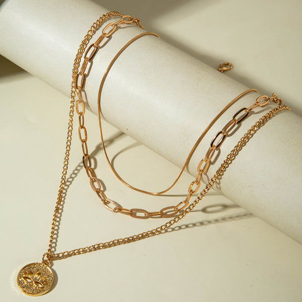 Elegant layered Y-necklace with pendant & multi-strand chains. Gold-plated stainless steel. Perfect for boho style & everyday elegance.