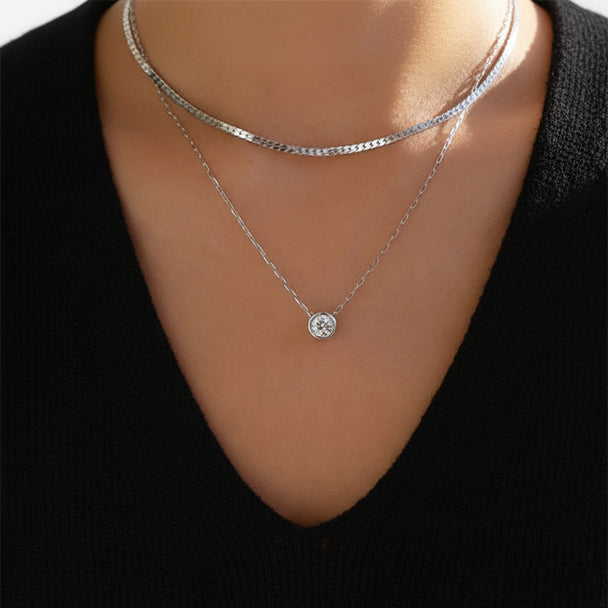 Elegant silver-plated double-layer necklace. Lightweight, delicate chains. Perfect for layering over sweaters & everyday elegance.