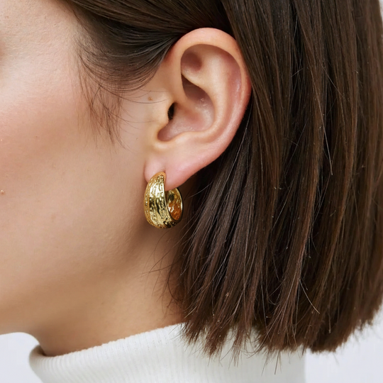 Modern textured wave hoop earrings in gold or silver. Lightweight sculptural design. Perfect for everyday elegance & office style.